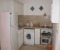 Fully equipped kitchen with small oven/grill, washing machine and kettle