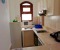 Fully equipped kitchen with stove, oven, washing machine and kettle