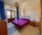 Bedroom 2 with double bed and access to terrace 