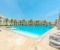 Large shared pool with sun loungers