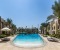 Large pool with sunbeds and umbrellas