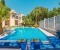 Shared pool with sun loungers and parasol