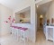 Kitchen with dining counter and corridor