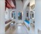 Oriental living area with additional sitting area on a platform and balcony