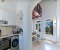 Fully equipped kitchen with dining counter with bar chairs 