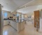 Spacious open-plan kitchen, dining area, and tastefully furnished living room
