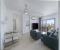Lightful modern living room with breakfast corner