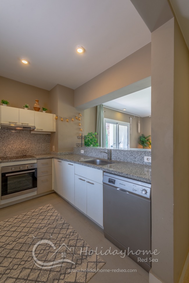 Large, fully equipped, and spacious kitchen for cooking.