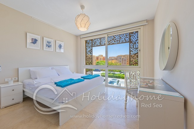 Lovely bedroom with desk.