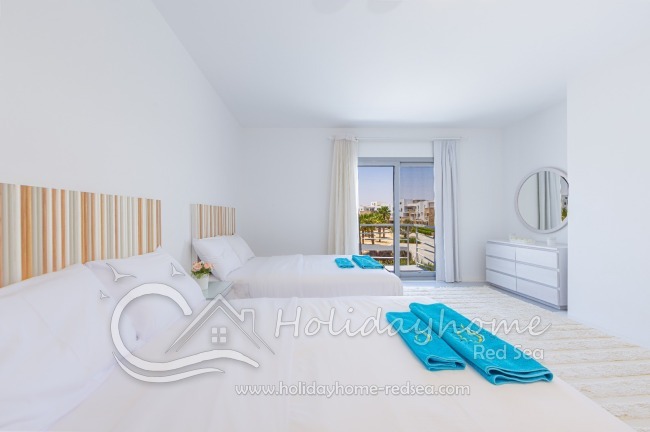 Bedroom with commode and mirror