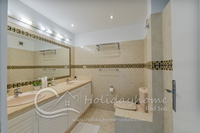 Bathroom to bedroom 1 with large counter and shower