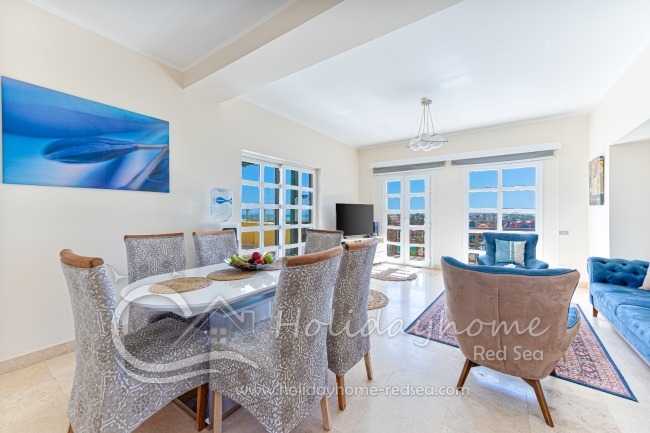 Dining area and spacious living room with smart TV