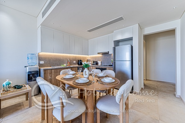 Dining table with spacious open kitchen