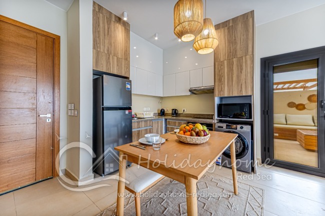 Fully equipped kitchen with access to the amazing roof terrace 