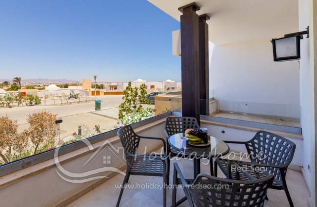 Balcony with table and chairs