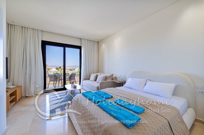 Modern equipped living room with large double bed