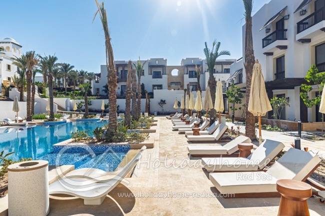 Sun loungers and umbrellas by the pool