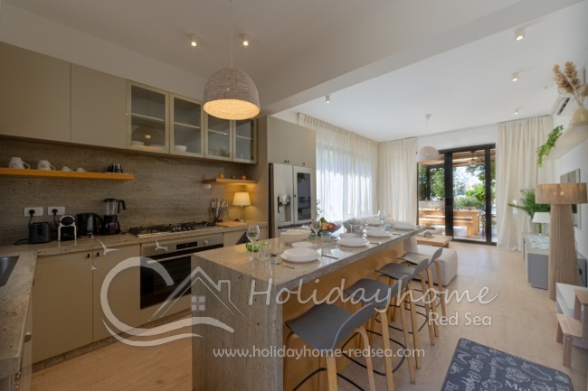 Open large kitchen with living room to the terrace