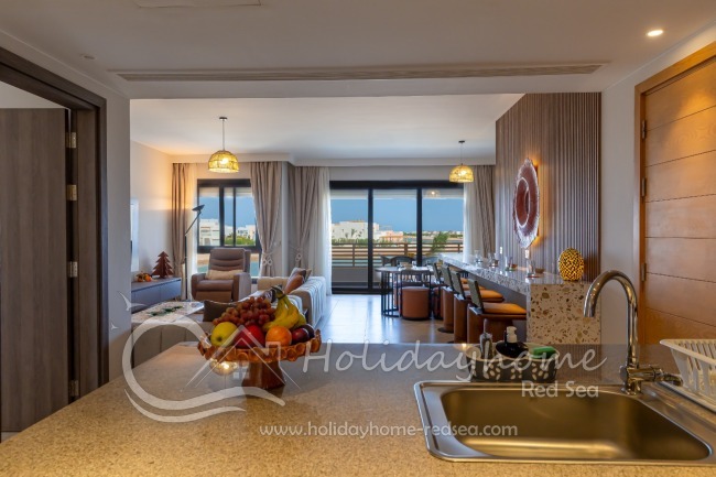View from the kitchen to the living room and balcony
